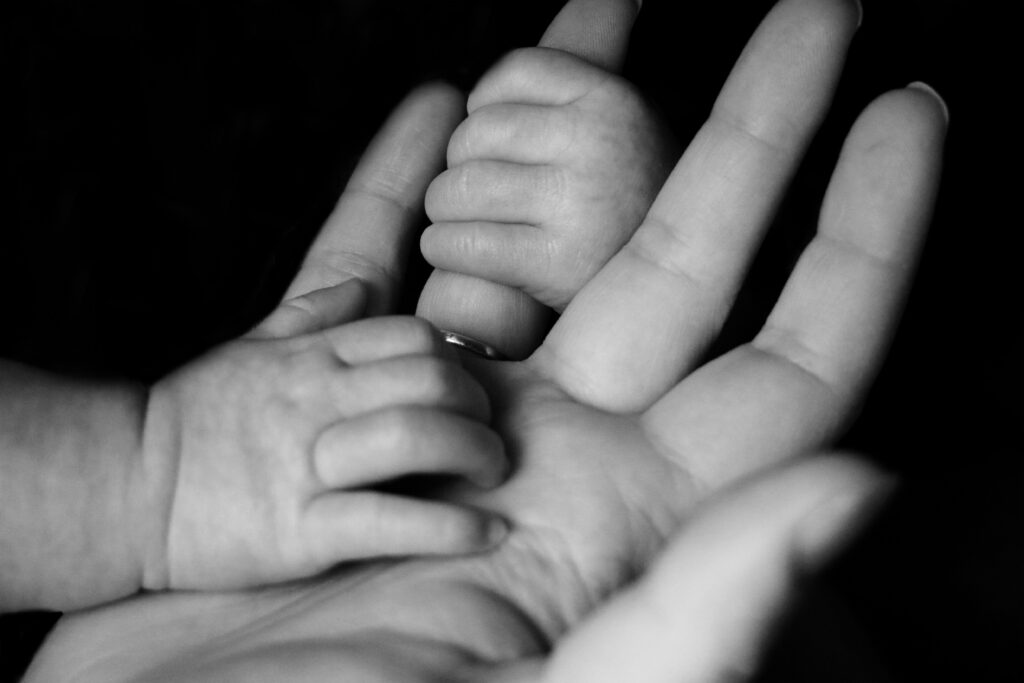baby's hand in adults 